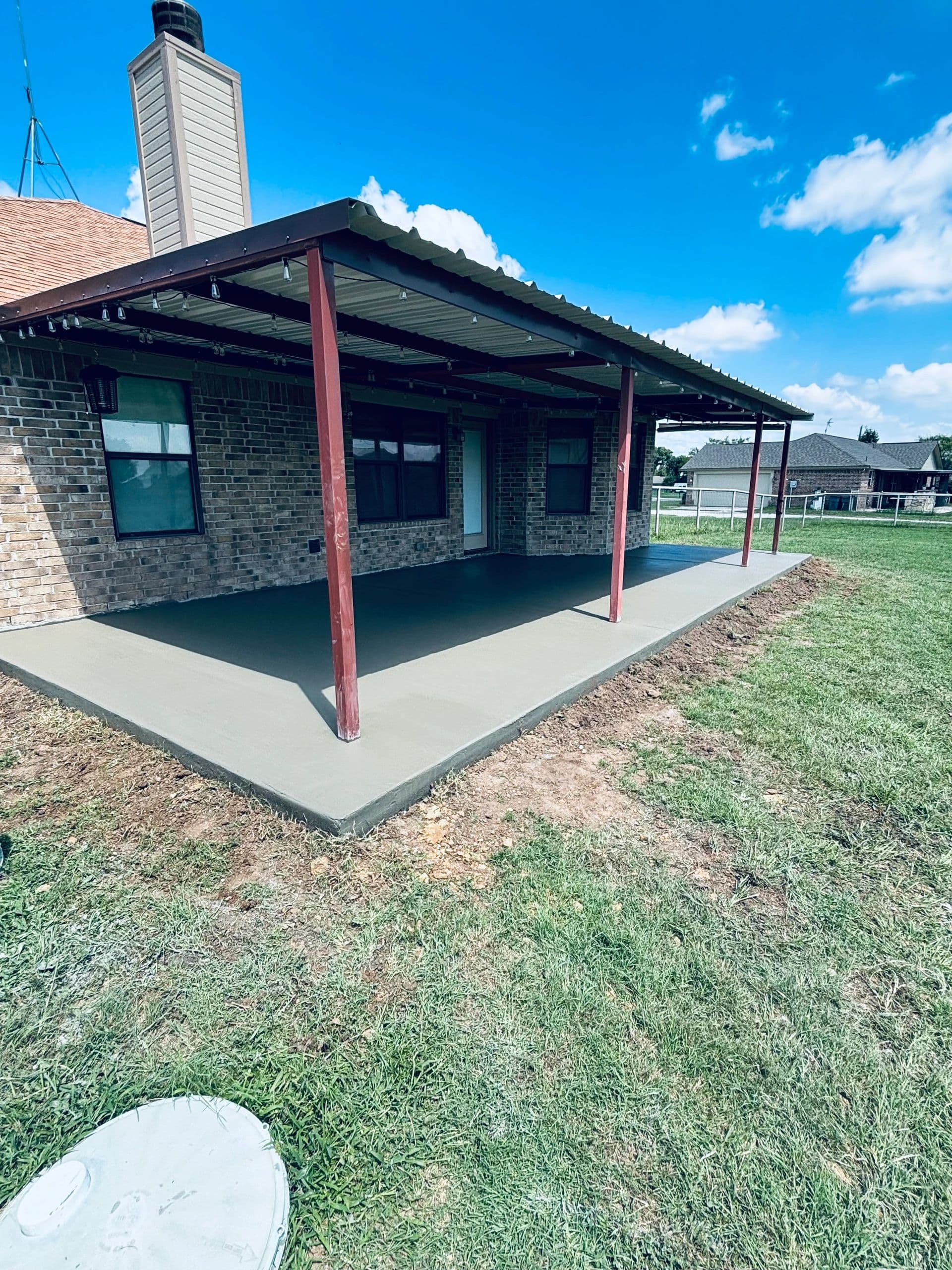 Freshly poured covered back porch patio slab