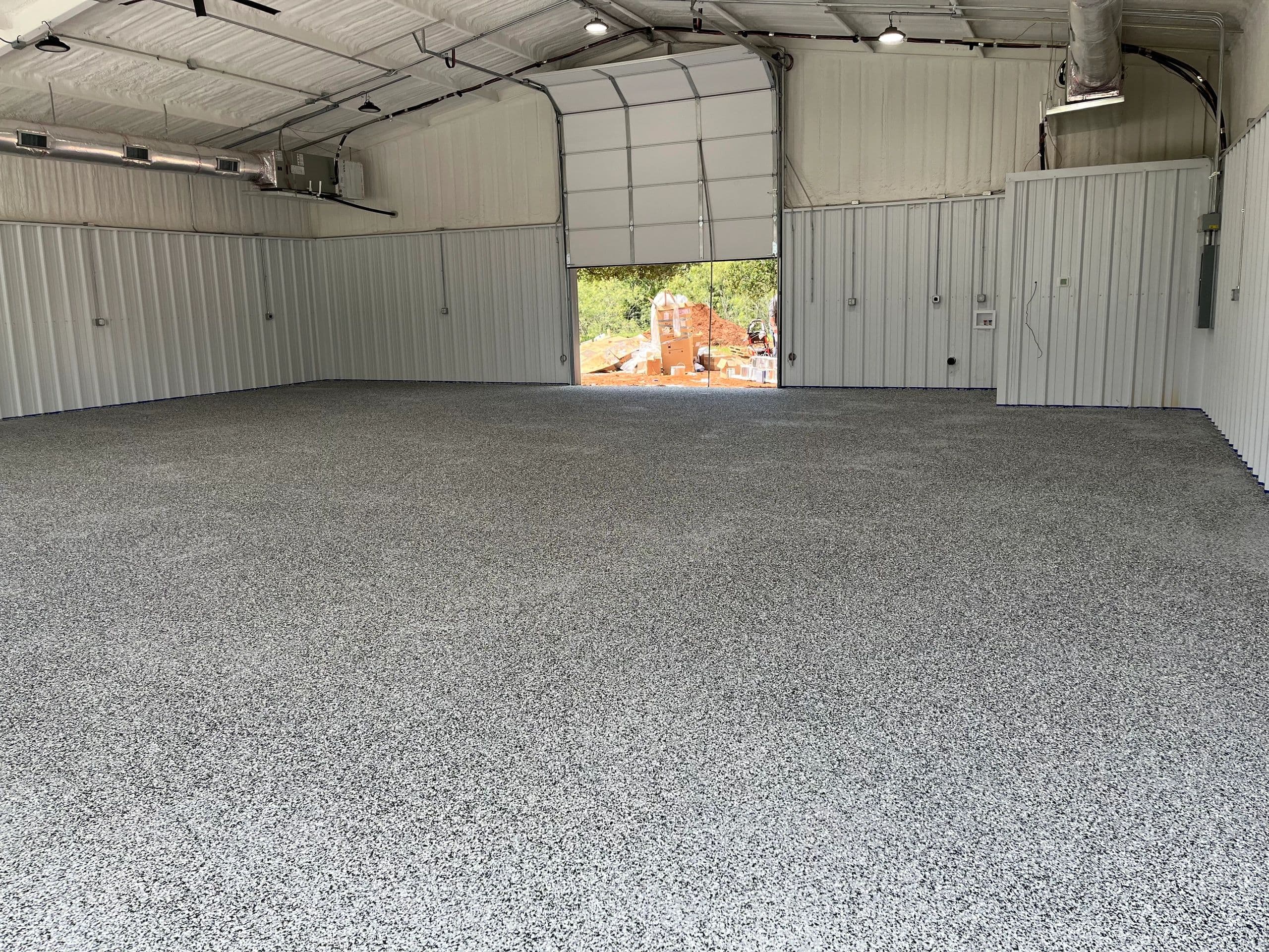 Decorative epoxy shop floor inside metal building