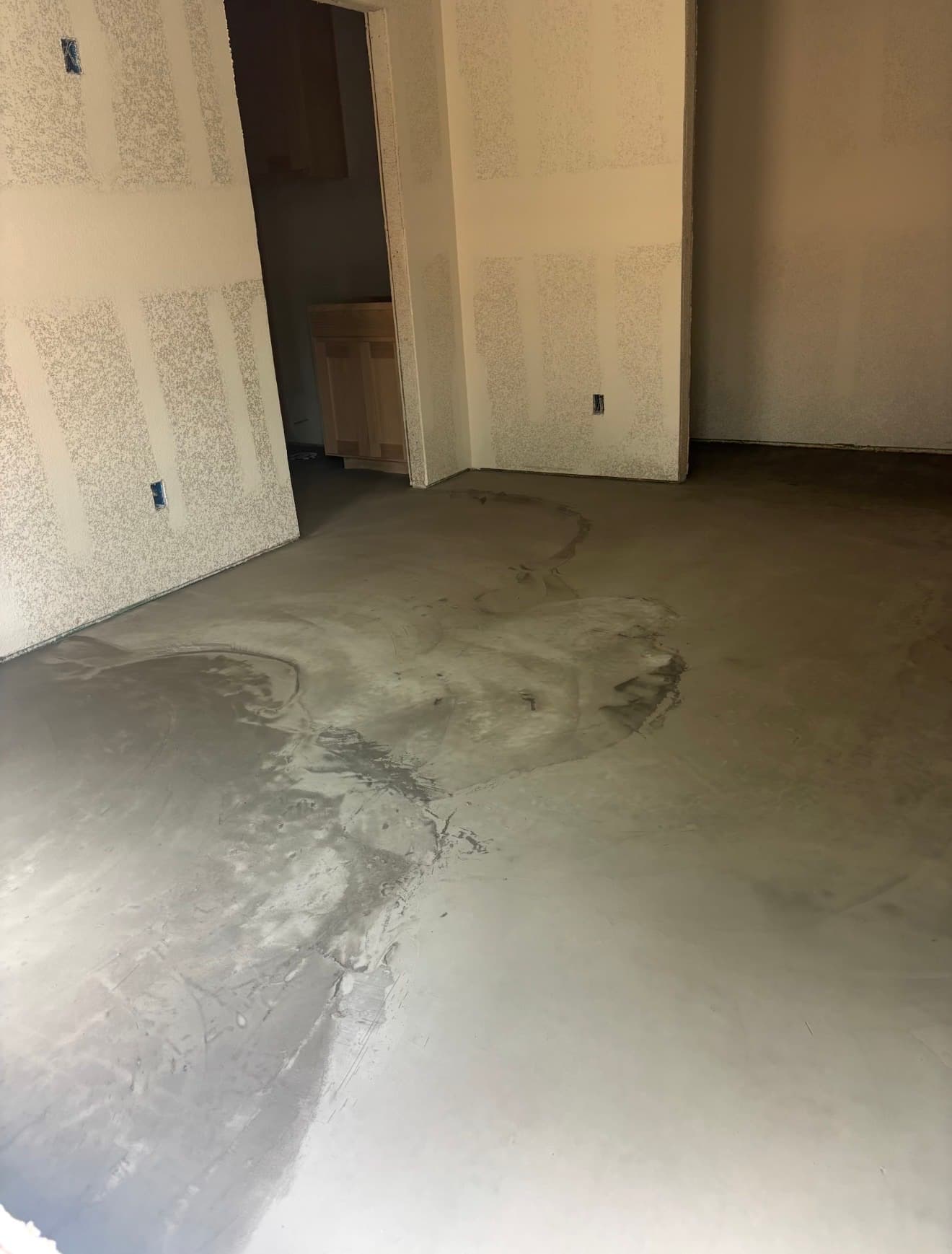 Concrete resurfacing overlay in progress on interior floor